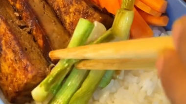 Rengoku-inspired Japanese bento box with glazed chicken, tofu, rice, and vegetables  